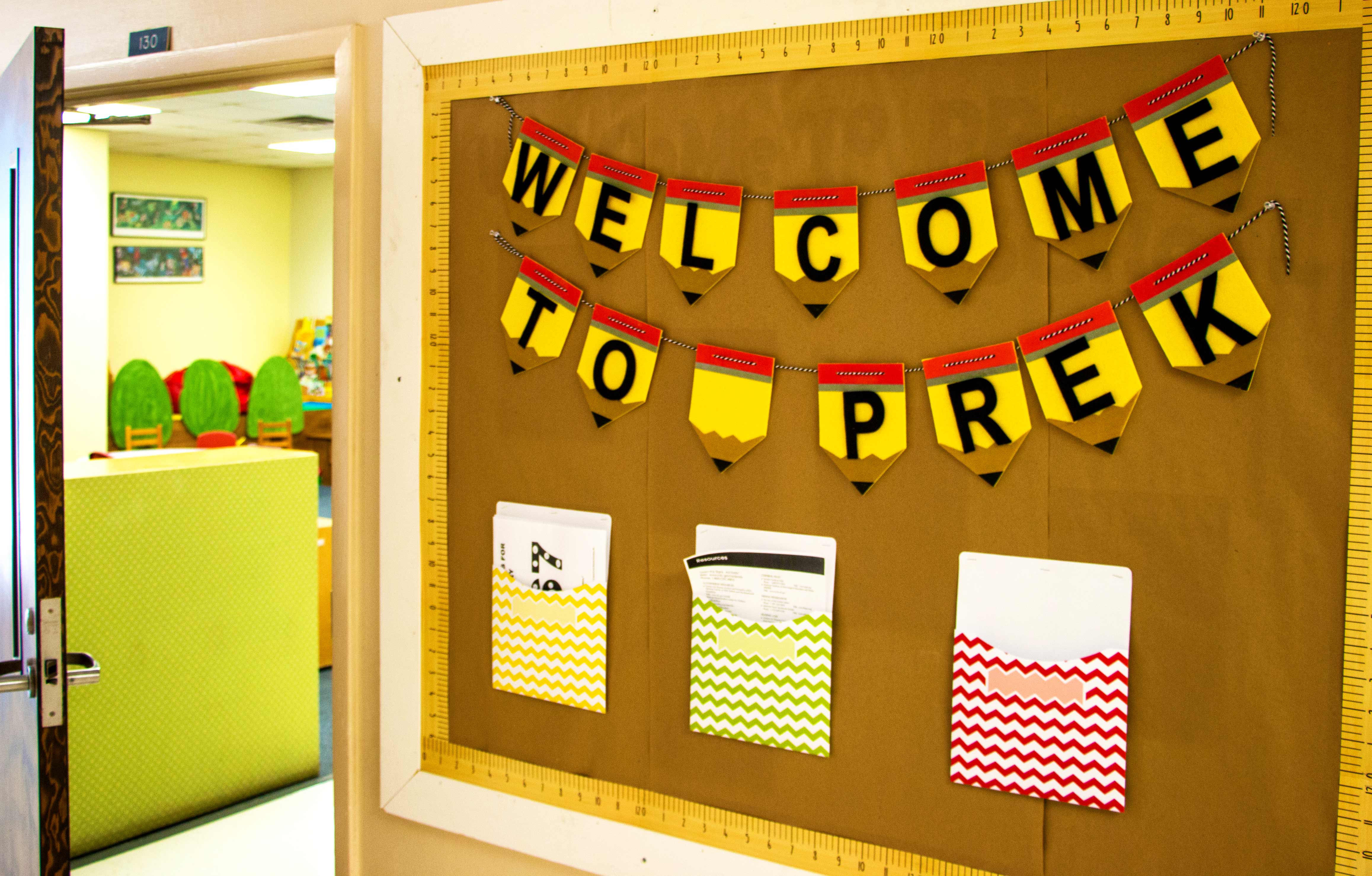 a bulletin board with "Welcome to Pre-K" in block letters